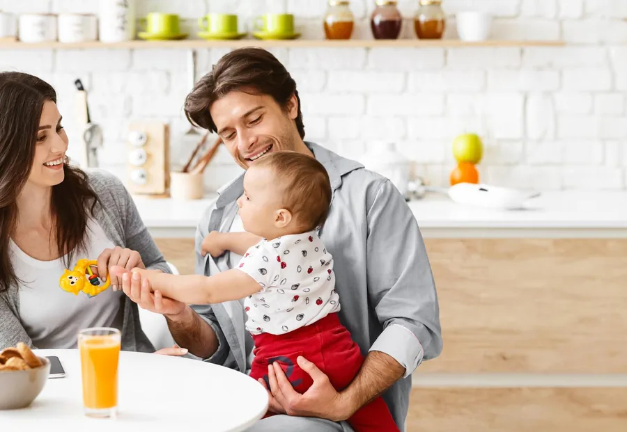 Family having breakfast together in a bright modern kitchen